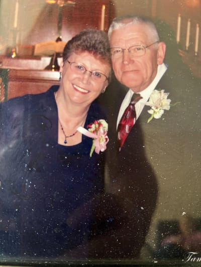 Smiling couple in formal attire