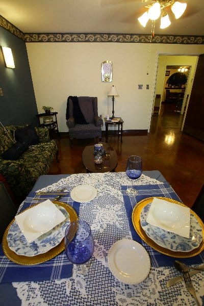 A dining table set for a meal in a cozy interior.