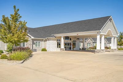 Exterior view of the facility entrance and landscaping.