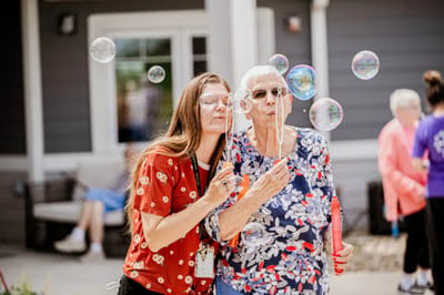 Residents enjoying bubble activity outdoors