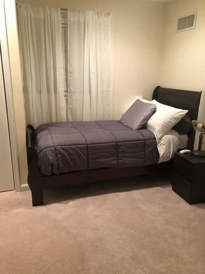 Cozy bedroom with a bed and curtains