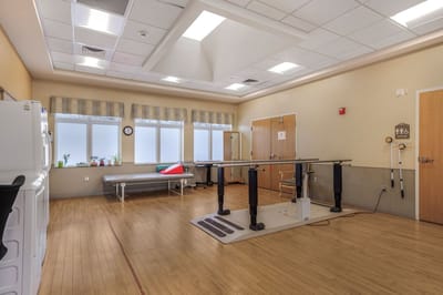 Interior therapy room with equipment and windows