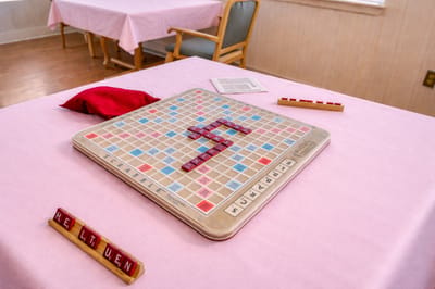 Scrabble game on a table in a common area