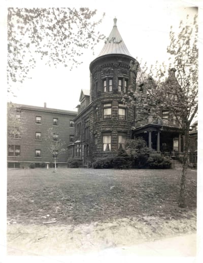 Exterior view of a historic nursing facility building.