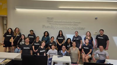 Group of staff members posing together in the center.