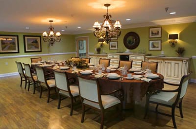Elegant dining room set for a meal.