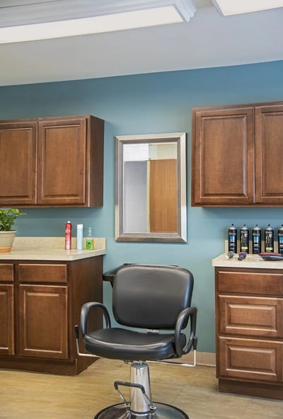 Interior view of a salon area with styling chair