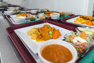 Meals served on trays in a dining area