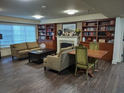 Cozy common area with seating and bookshelves