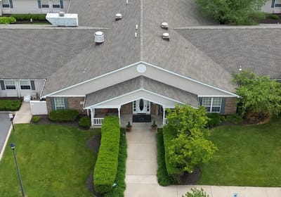 Aerial view of the building entrance with landscaping