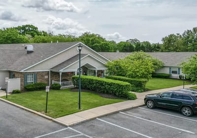 Exterior view of Arden Courts of Wilmington with landscaped grounds