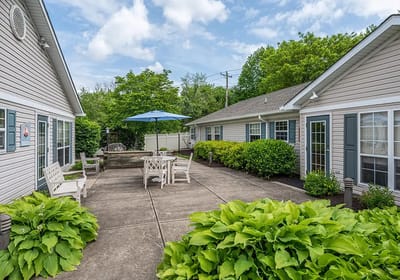 Outdoor courtyard area with seating and greenery