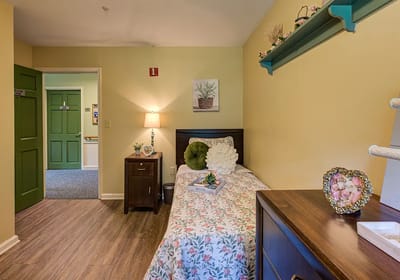Cozy private resident room with floral bedding