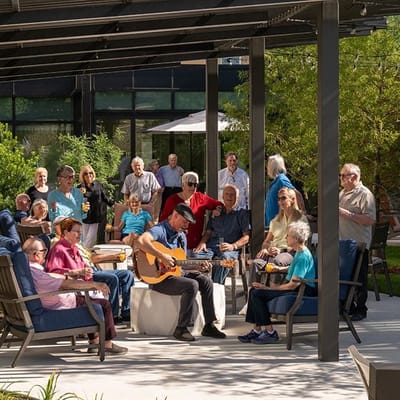 Residents enjoying music during an outdoor activity