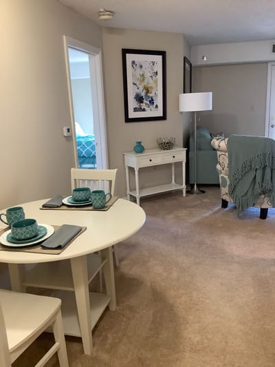 Cozy living area with dining space in a resident unit