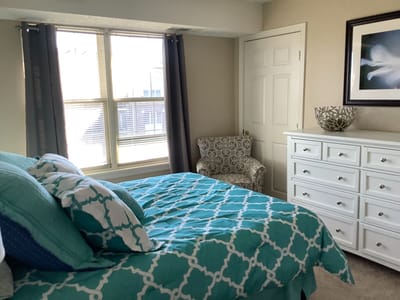 Cozy resident room with bright window and colorful decor