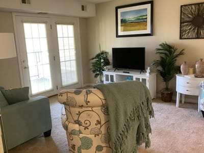 Cozy living area with plants and a television