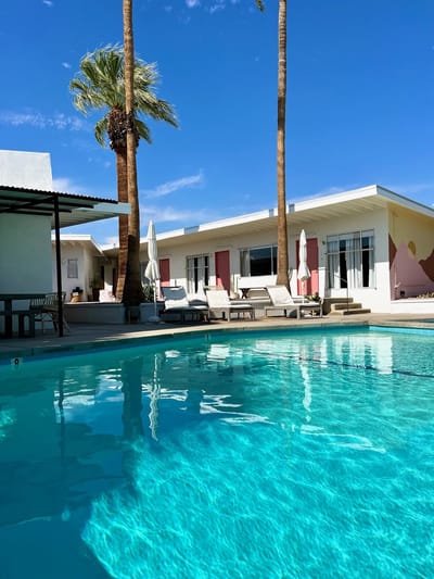 A beautiful outdoor pool area with palm trees