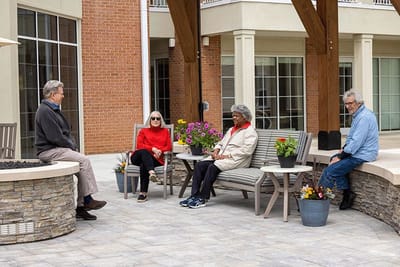 Residents enjoying time together in the outdoor courtyard