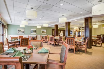 Dining area with tables set for meal service