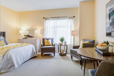Cozy resident room with soft lighting and comfortable furnishings