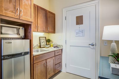 Well-decorated kitchenette in a resident's room