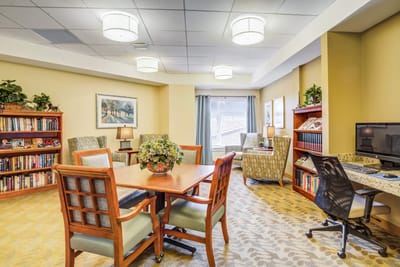 Bright common area with seating and bookshelves