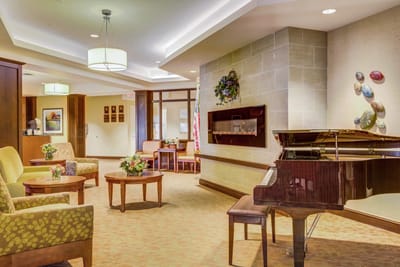 Interior common area with piano and seating