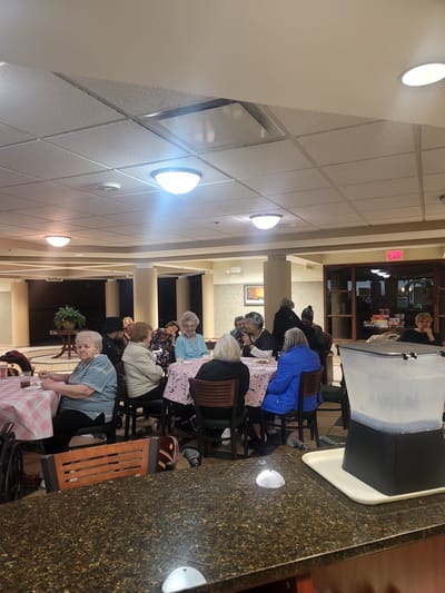 Residents enjoying a group activity in the common area