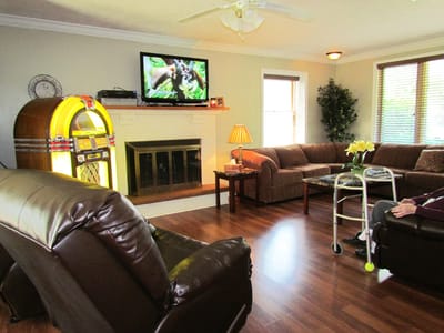 Common area with a jukebox and residents relaxing