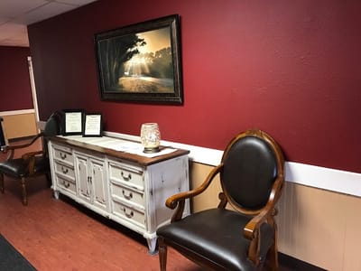Interior of a cozy common area with chairs and decor