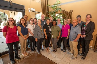 Group photo of staff members in the lobby