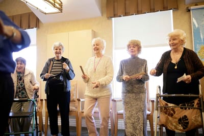 Residents participating in a lively activity in a common area