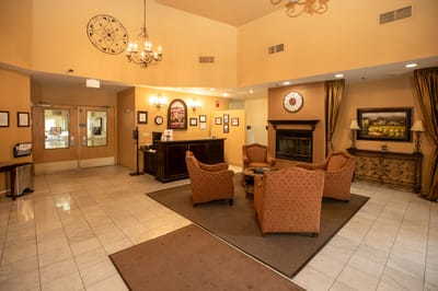 Cozy common area with chairs and fireplace