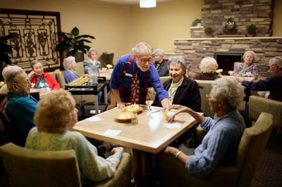 Residents enjoying a meal in a communal dining area
