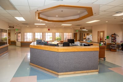 Interior view of a common area with a reception desk