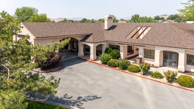 Exterior view of Hearthstone facility with landscaped area