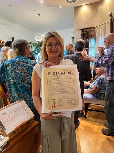 Residents and staff celebrating with a proclamation