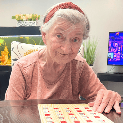 Resident playing bingo in a common area