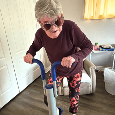 Resident engaging with a mobility device in their room