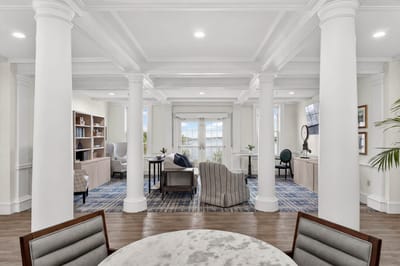 Bright common area with seating and bookshelves