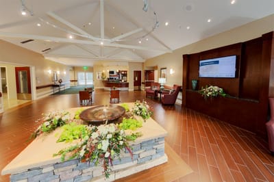Interior view of a welcoming lobby area with flowers