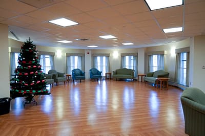 Bright common area with Christmas tree and seating