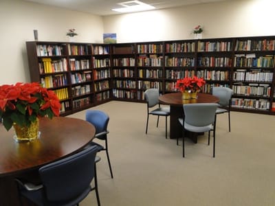 Interior of a library with bookshelves and tables