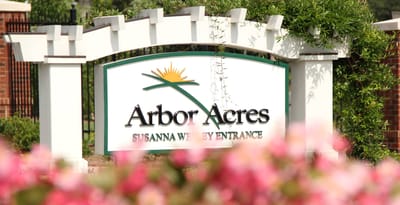 Facility entrance sign with logo and name