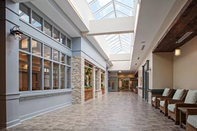 Bright interior corridor with seating and natural light
