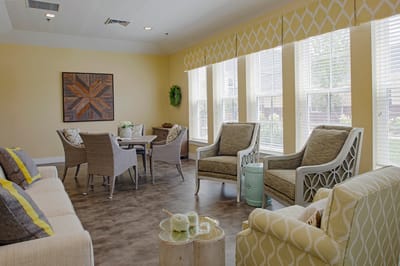 Bright common area with cozy seating and natural light
