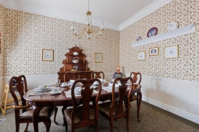 Dining room set for a meal in a senior living facility