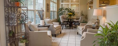 Bright and cozy common area with seating and plants