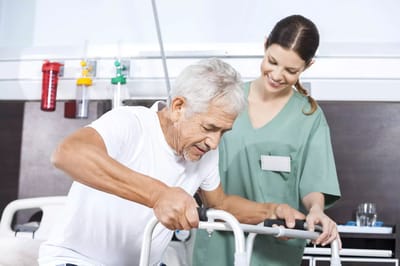 A caregiver assisting a senior resident with a walker